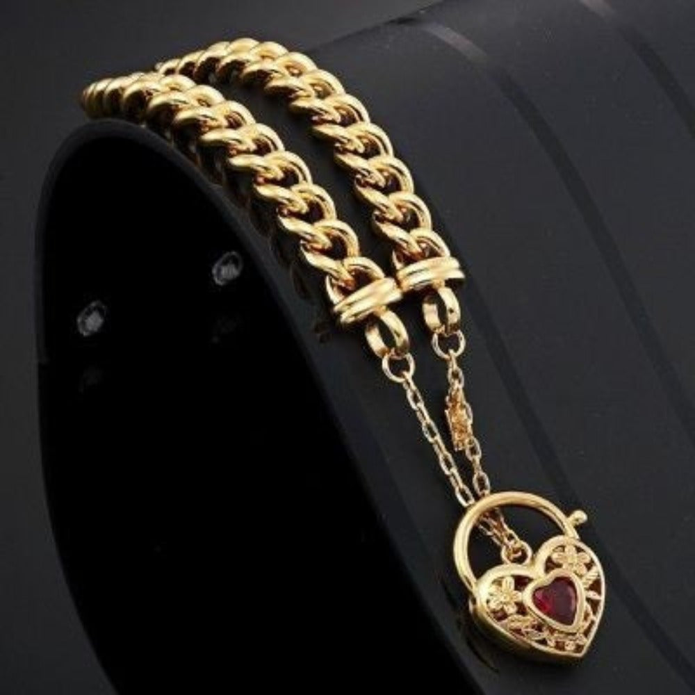18ct Heavy Yellow Gold Plated Euro Chain Bracelet featuring a filigree locket and simulated ruby, showcasing intricate design and luxurious finish.