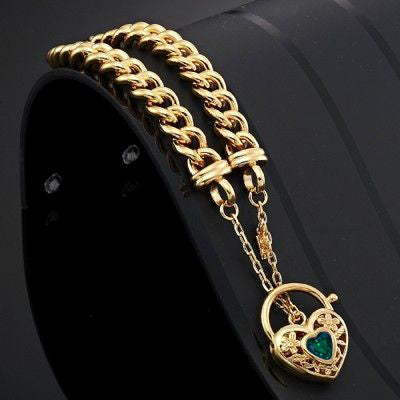 18ct Heavy Yellow Gold Plated Euro Chain Bracelet featuring a green filigree locket, showcasing its elegant design and quality craftsmanship.