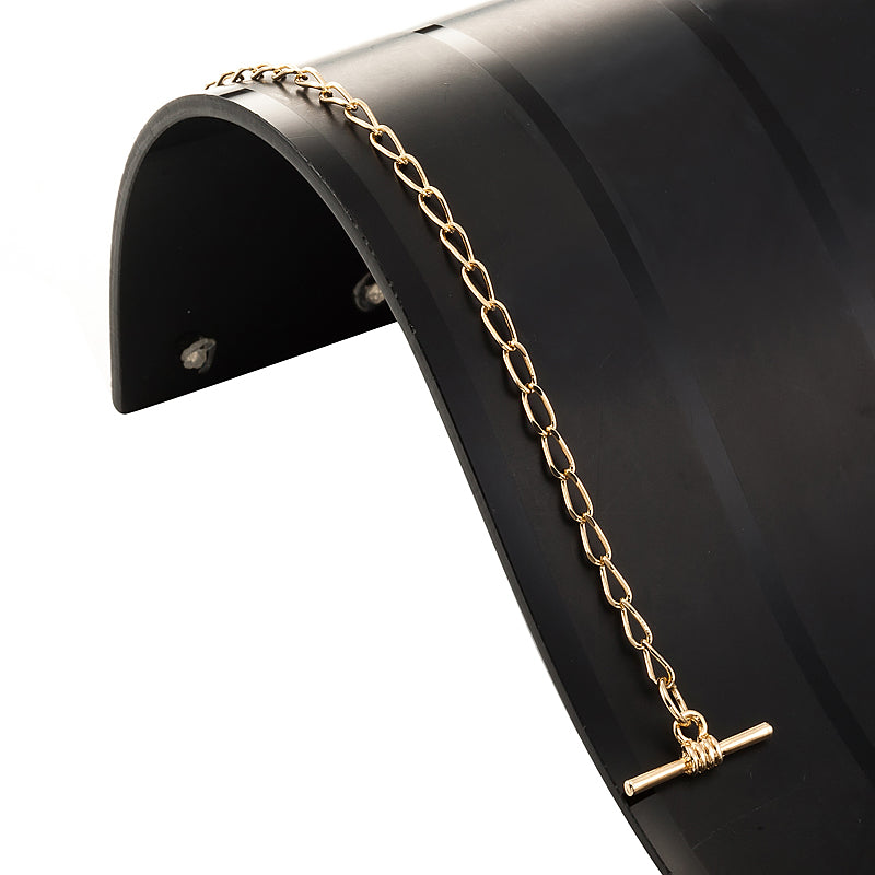 18ct Heavy Yellow Gold Plated Le Mans Child Bracelet with T-Bar, showcasing its elegant design and craftsmanship.