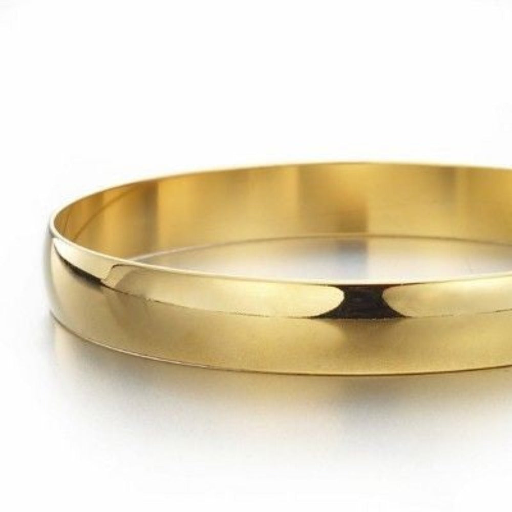 A beautiful 18ct heavy yellow gold plated plain bangle made in the USA, showcasing a sleek and elegant design.