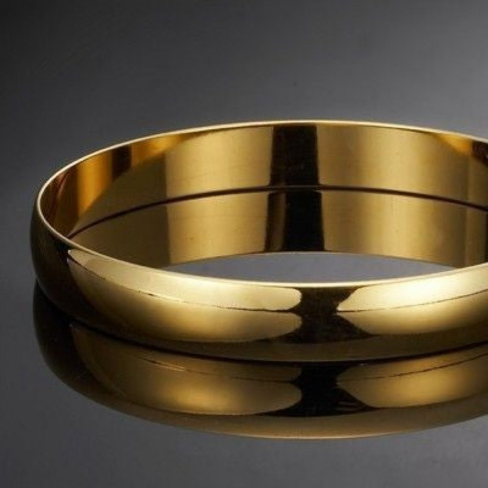 A beautiful 18ct heavy yellow gold plated plain bangle made in the USA, showcasing a sleek and elegant design.