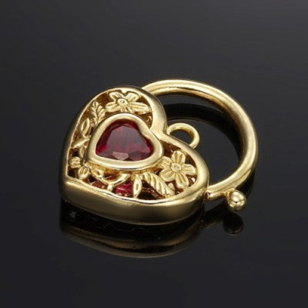18ct Heavy Yellow Gold Plated Simulated Ruby Filigree Heart Locket with intricate design and vibrant ruby center.