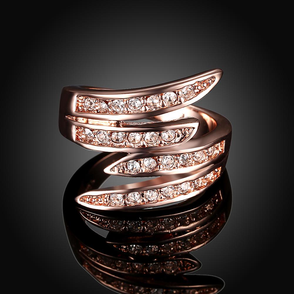 Elegant 18K rose gold plated Elements Ariana Ring featuring a curved design and white AAAAA quality stones.