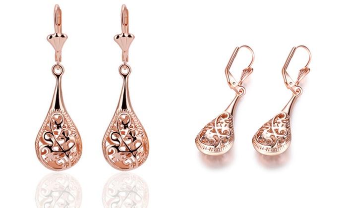 Elegant 18K rose-gold plated bohemian laser cut drop earrings showcasing intricate designs and a stylish leverback closure.