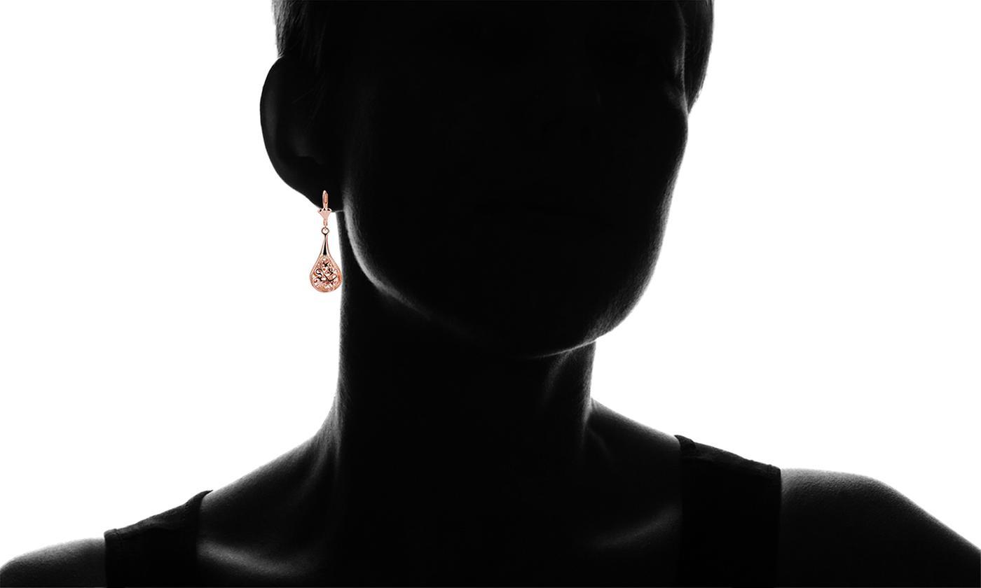 Elegant 18K rose-gold plated bohemian laser cut drop earrings showcasing intricate designs and a stylish leverback closure.