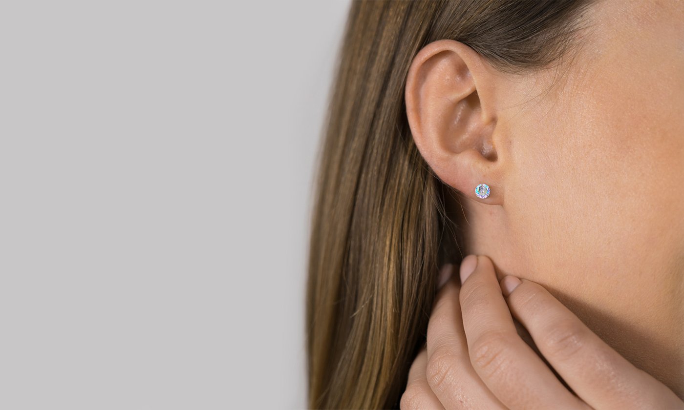 A pair of elegant 18K white gold-plated birthstone stud earrings, showcasing vibrant colors and a high polish finish, perfect for any occasion.