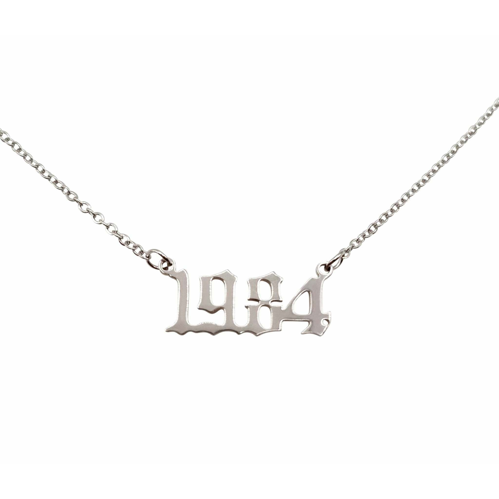 A stylish 1984 Year Necklace made of tarnish-free stainless steel, available in gold and silver, featuring a modern design with an 18-inch chain.