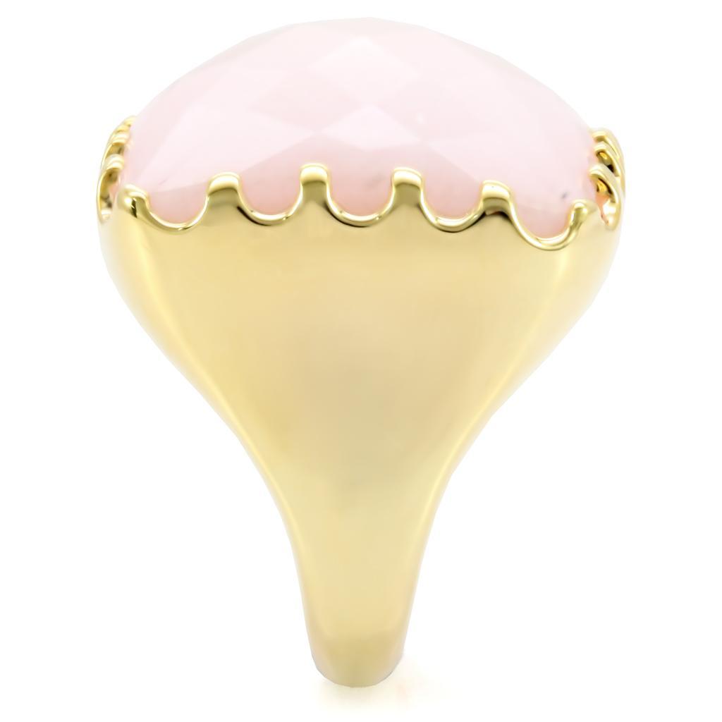 Gold brass ring featuring a rose-colored synthetic jade stone, elegantly designed for stylish wear.