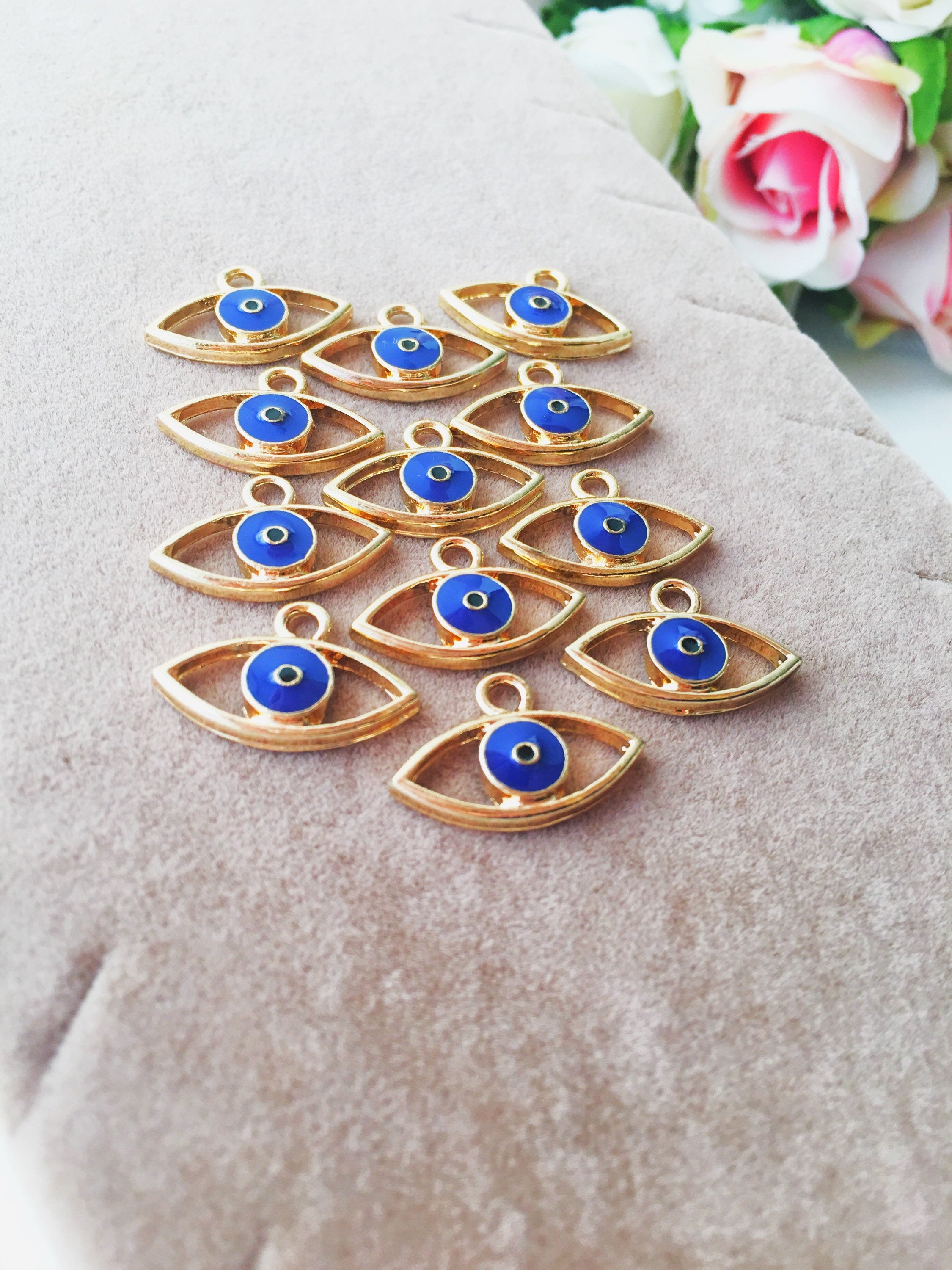 Two blue evil eye charms made of brass, featuring a 20mm size and 2mm hole, symbolizing protection and good fortune.