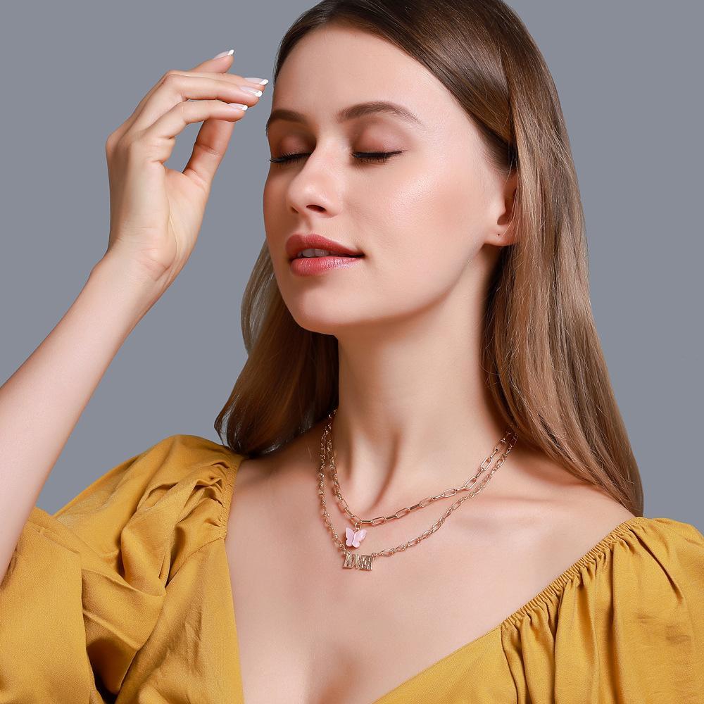 Elegant 2 Piece Butterfly Lover Necklace in 18K gold plating, featuring a delicate butterfly design and adjustable link chain.