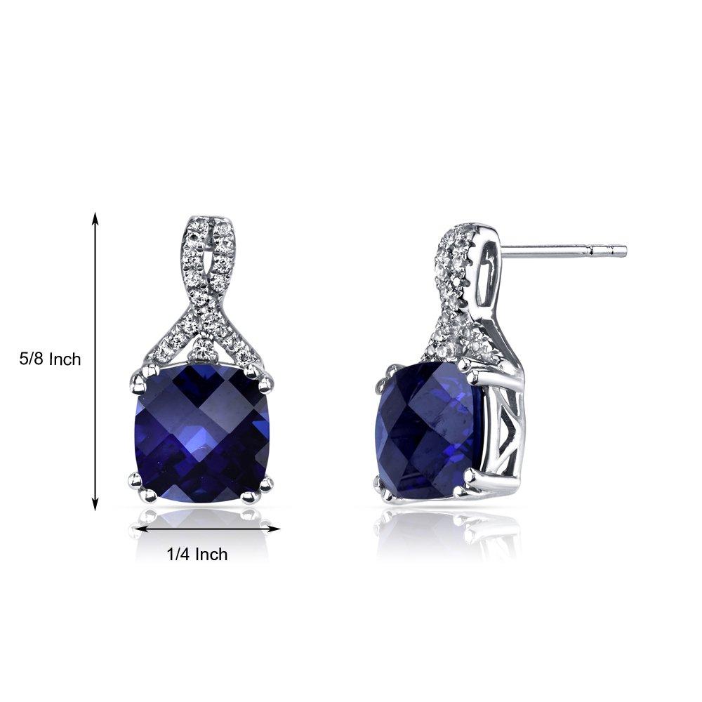 Elegant 2.00 CT cushion cut sapphire stud earrings set in 18K white gold plating, showcasing their brilliant blue color and luxurious design.