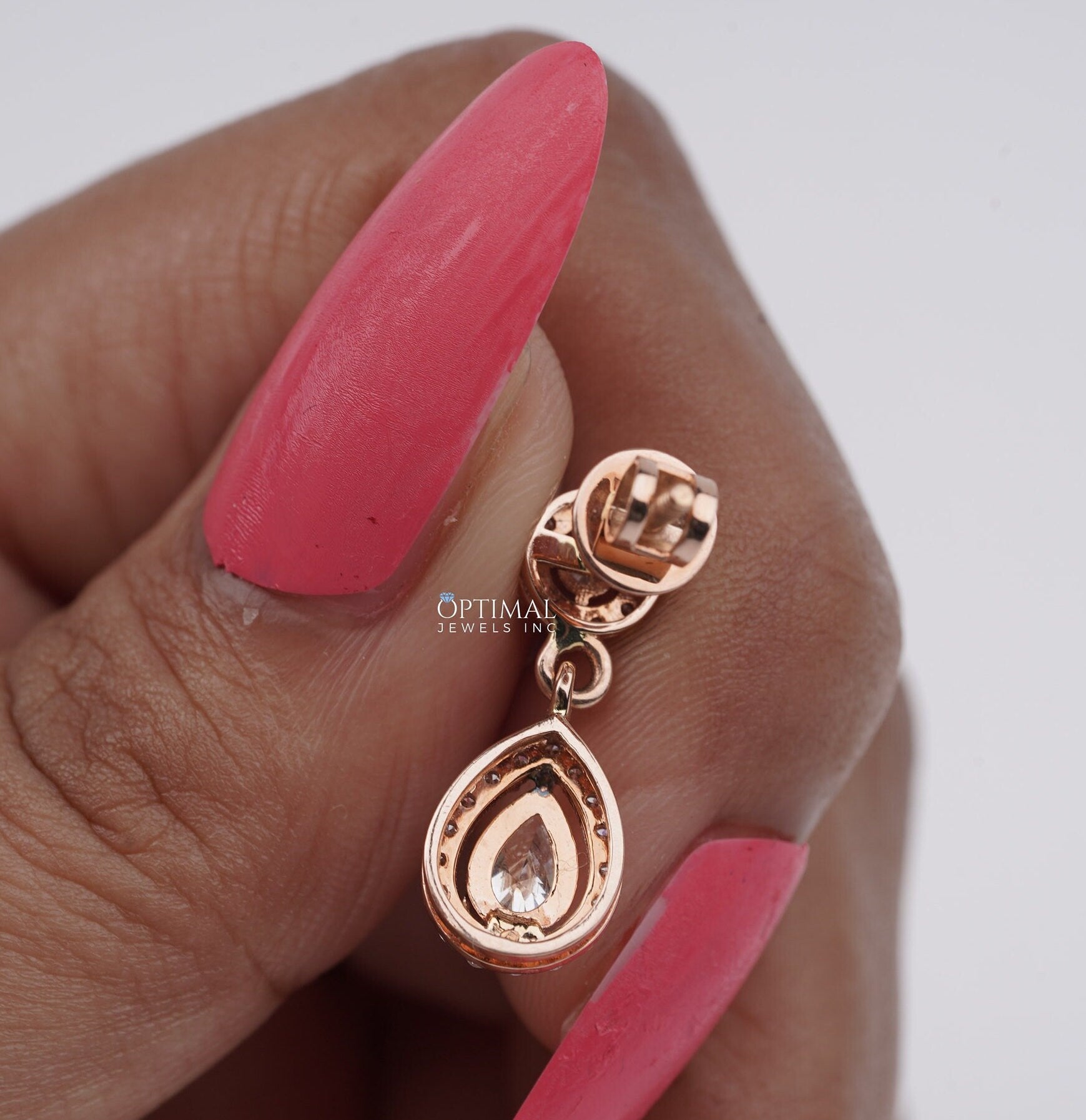 Elegant 2.00 CTW Round and Pear Lab-Grown Diamond earrings in a two-stone halo design, showcasing brilliant sparkle and modern elegance.