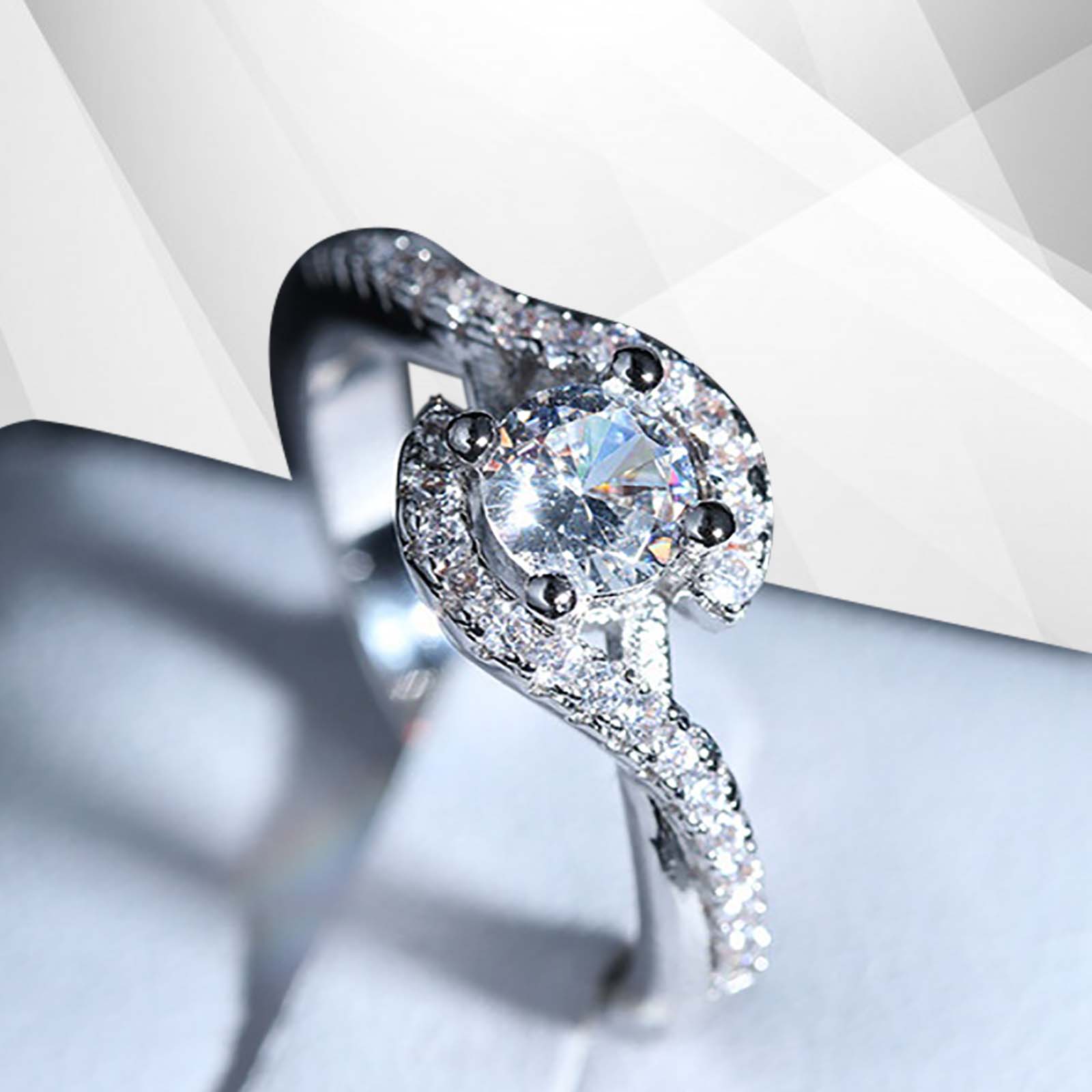 2.0Ct Round-Cut Halo Engagement Ring featuring 31 CZ diamonds set in 18Ct white gold, elegantly displayed in a presentation box.