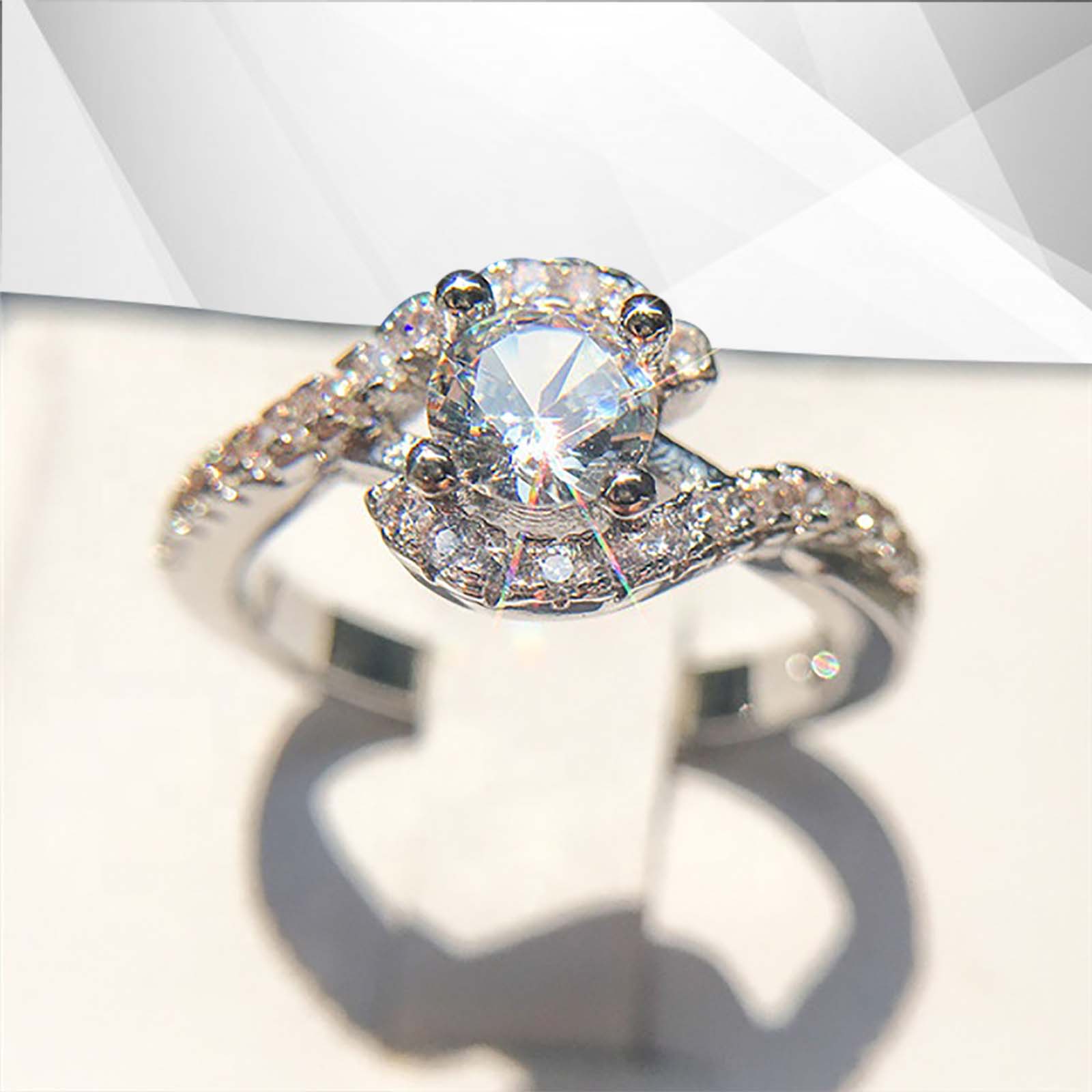 2.0Ct Round-Cut Halo Engagement Ring featuring 31 CZ diamonds set in 18Ct white gold, elegantly displayed in a presentation box.