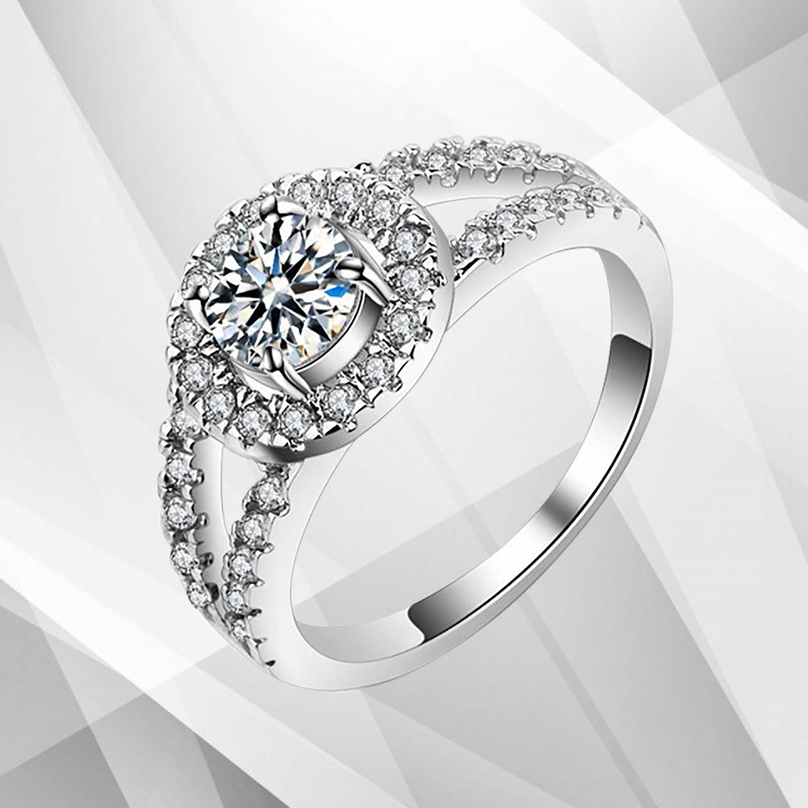 2.0Ct Round-Cut Diamond Halo Bridal Engagement Ring set in 18Ct White Gold, featuring a central round diamond surrounded by a halo of smaller stones.