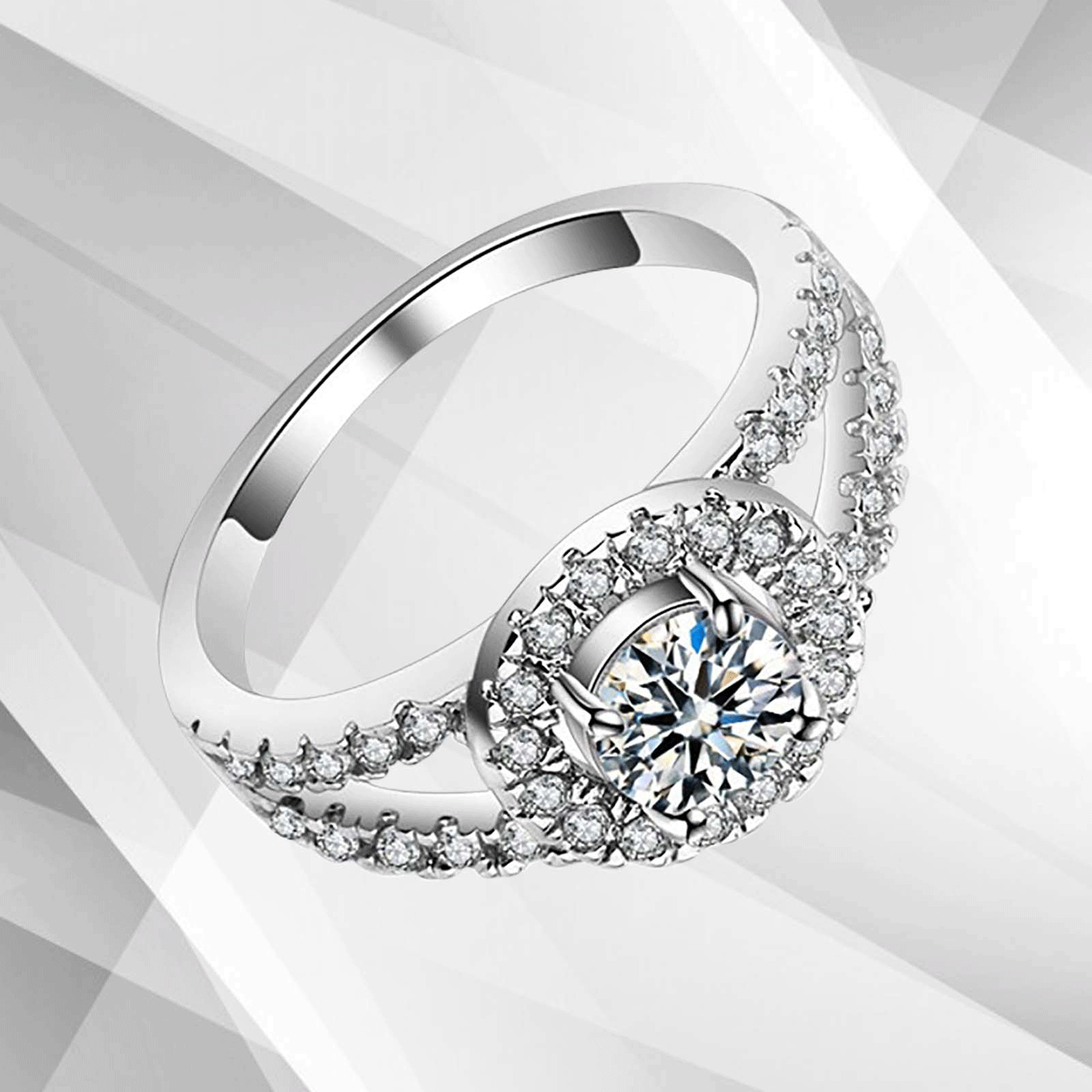 2.0Ct Round-Cut Diamond Halo Bridal Engagement Ring set in 18Ct White Gold, featuring a central round diamond surrounded by a halo of smaller stones.