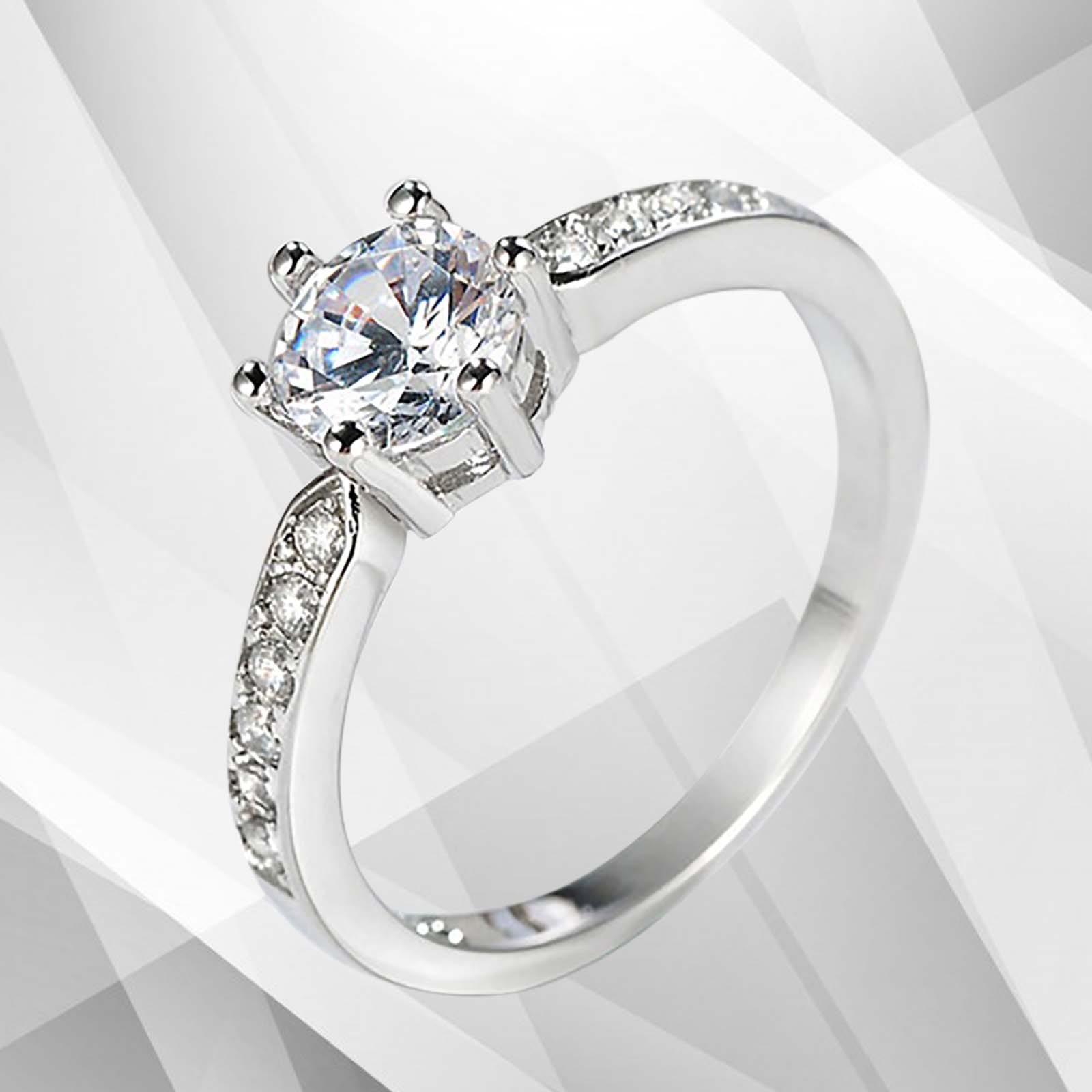 2.0Ct round-cut diamond solitaire engagement ring in 18Ct white gold setting, featuring 6 claw prong settings and a brilliant shine.