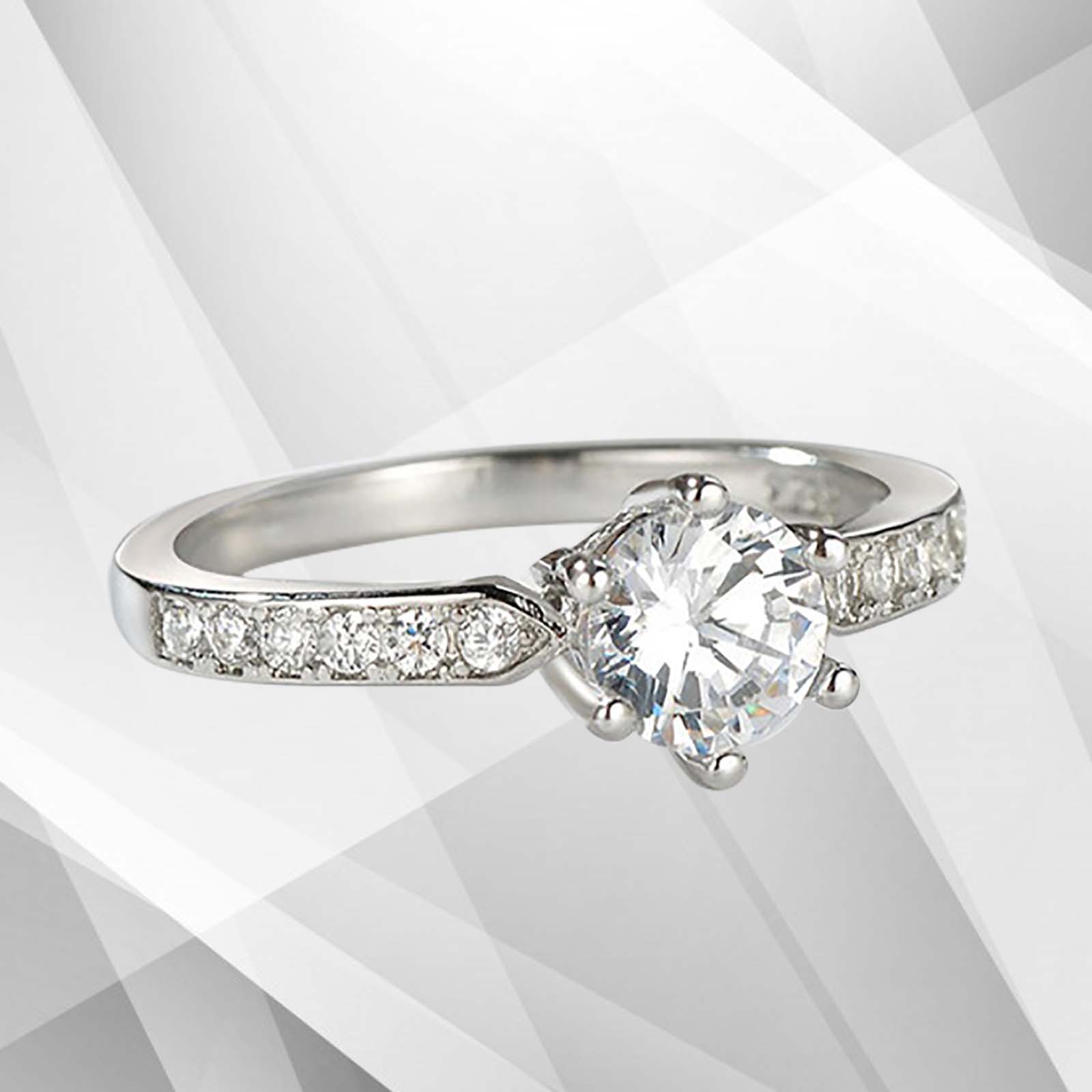 2.0Ct round-cut diamond solitaire engagement ring in 18Ct white gold setting, featuring 6 claw prong settings and a brilliant shine.