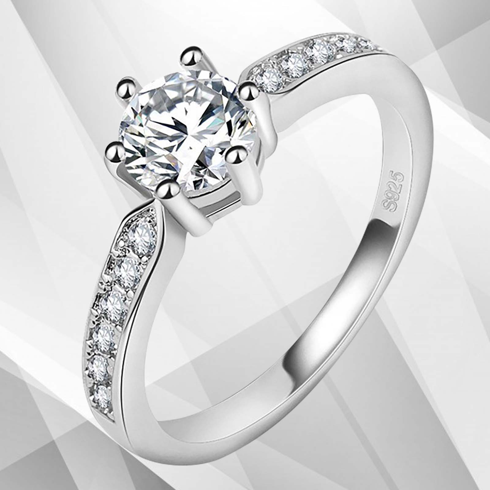 2.0Ct round-cut diamond solitaire engagement ring in 18Ct white gold setting, featuring 6 claw prong settings and a brilliant shine.