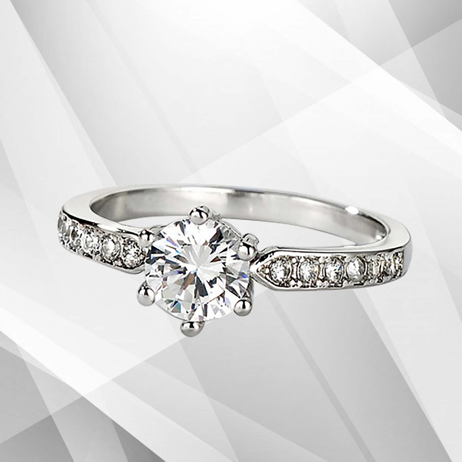 2.0Ct round-cut diamond solitaire engagement ring in 18Ct white gold setting, featuring 6 claw prong settings and a brilliant shine.