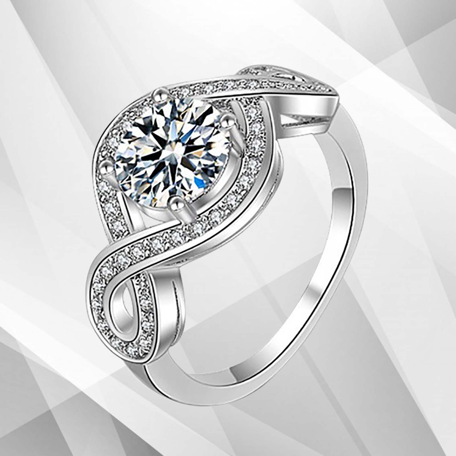2.5Ct Round-Cut Diamond Cushion Halo Bridal Engagement Ring set in 18K white gold, featuring a central diamond surrounded by a halo of smaller stones.