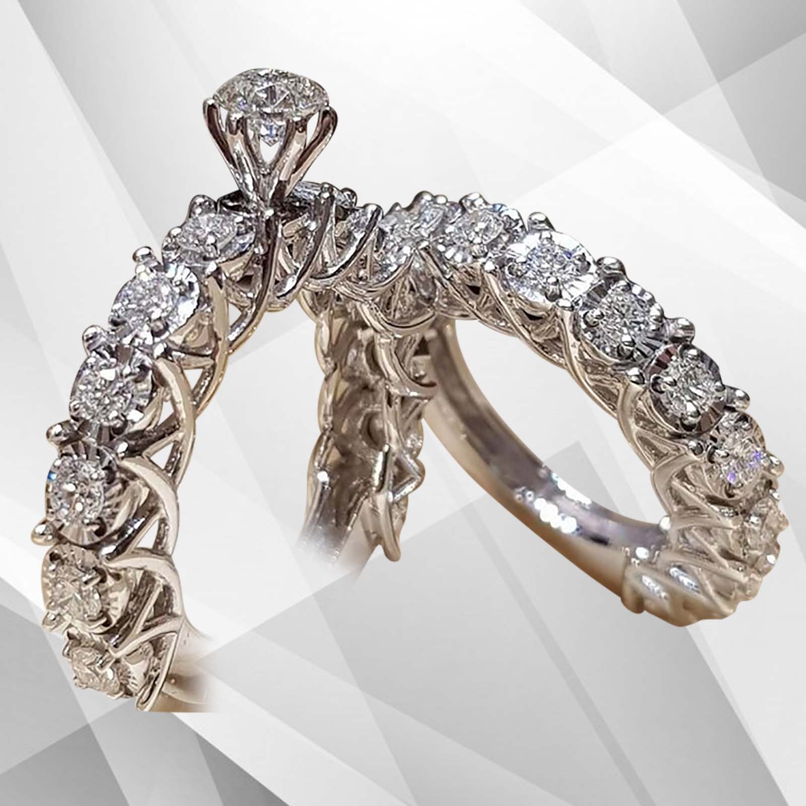 Elegant 2.5Ct total CZ diamonds solitaire bridal engagement ring in 18K white gold with prong and bar settings.