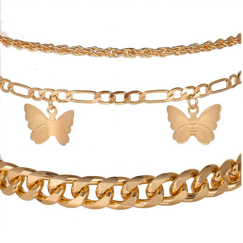 A luxurious 3 Piece Chain and Butterfly Bracelet Set in 18K gold plating, showcasing intricate designs and a comfortable fit.