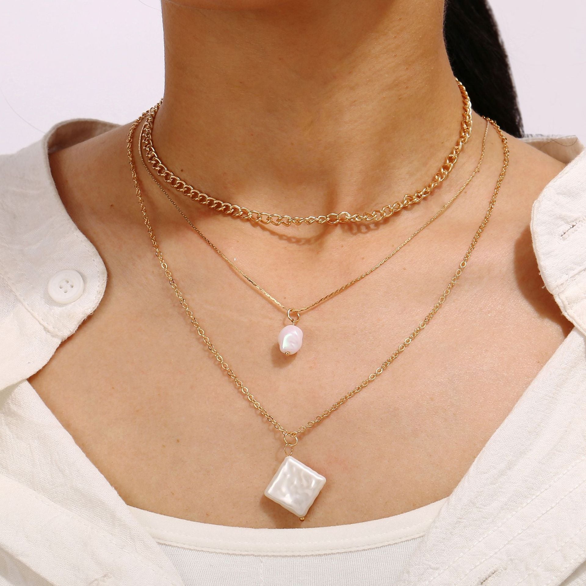 Elegant 3 Piece Pearl Linear Chain Necklace in 18K gold plating, featuring a unique linear design and a lobster clasp closure.