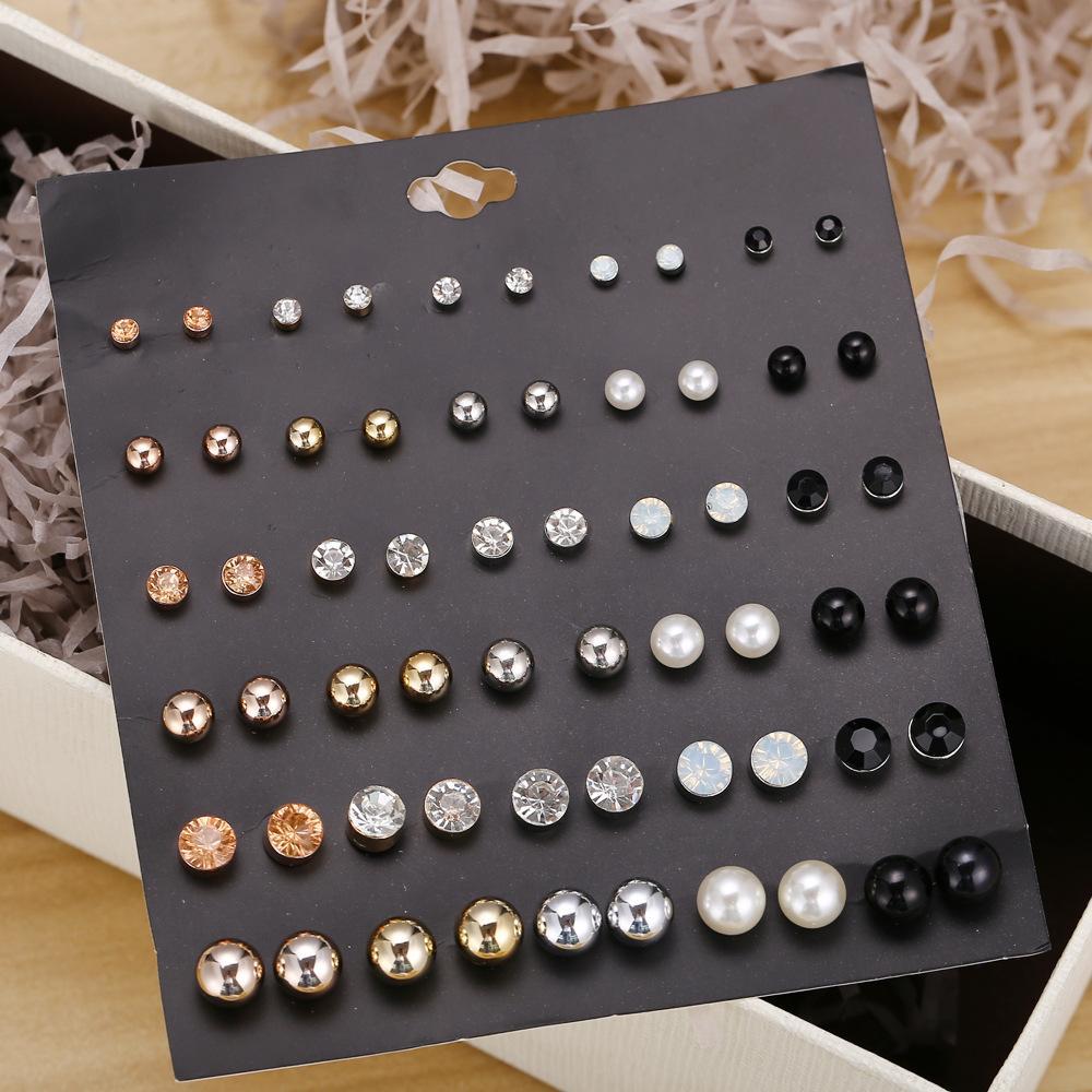 A beautiful 30 piece stud earring set featuring various designs, all elegantly crafted with 18K gold plating, showcasing their shine and quality.