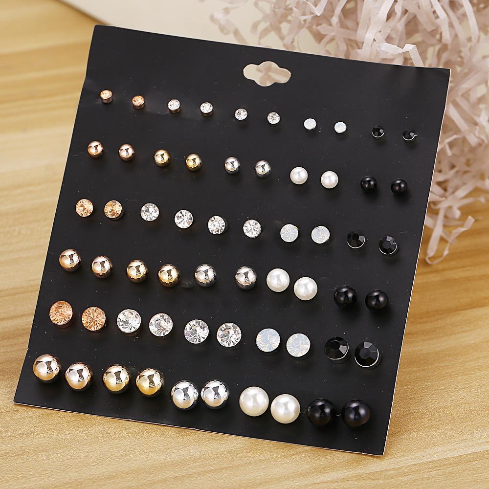 A beautiful 30 piece stud earring set featuring various designs, all elegantly crafted with 18K gold plating, showcasing their shine and quality.