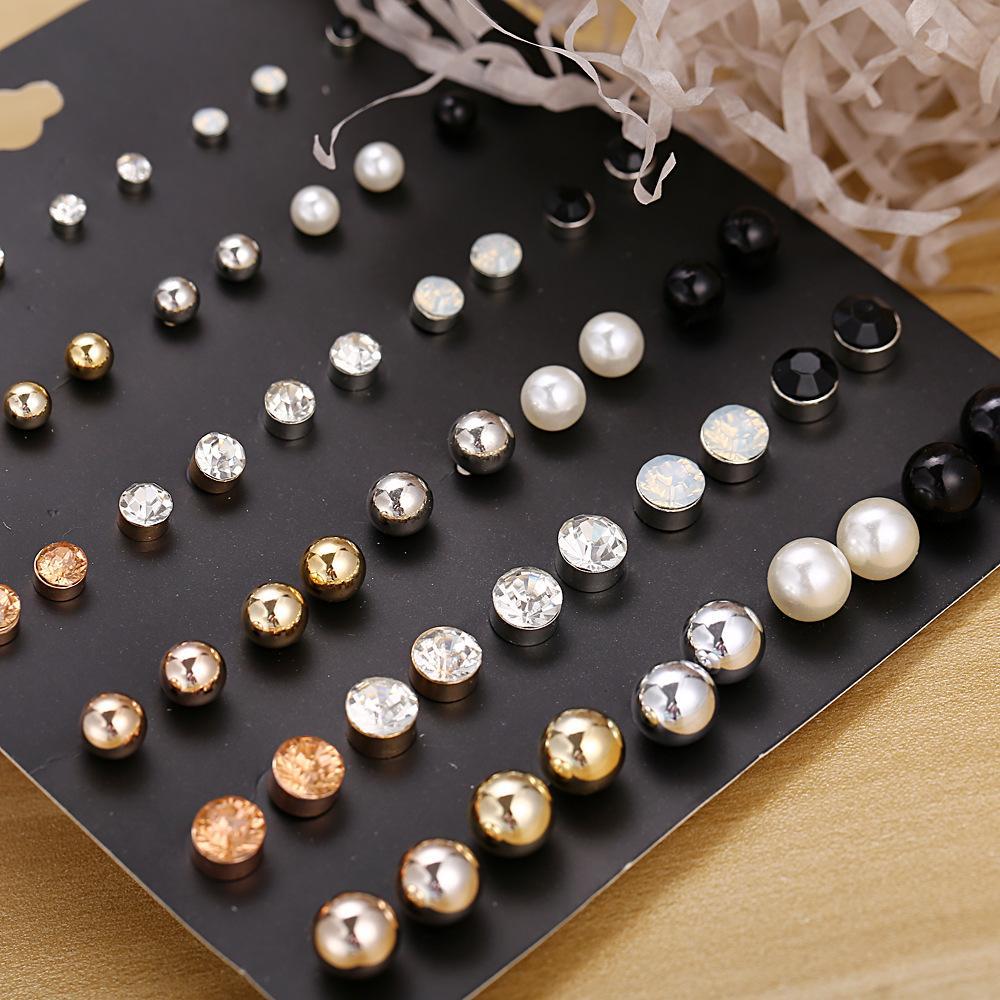 A beautiful 30 piece stud earring set featuring various designs, all elegantly crafted with 18K gold plating, showcasing their shine and quality.
