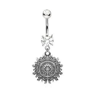 A detailed 316L stainless steel navel ring featuring an antique Polynesian sun design with a sparkling cubic zirconia gem.