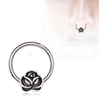 A 316L stainless steel captive bead ring featuring an antique gold plated flower with a partially black plated rose, showcasing intricate details.