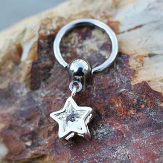 A 316L stainless steel captive bead ring featuring an 8mm clear star-shaped cubic zirconia dangle, perfect for various piercings.
