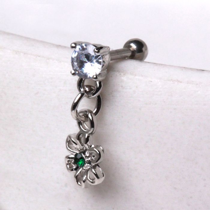 A 316L stainless steel cartilage earring featuring a flower dangle with an emerald green cubic zirconia centerpiece and prong set CZs.