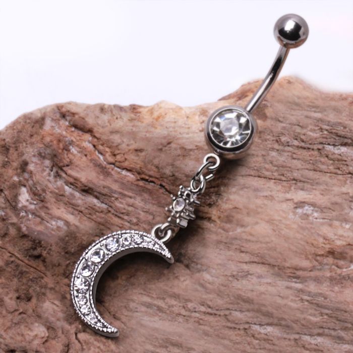 A beautiful 316L stainless steel navel ring featuring a dangle design of a crescent moon and star, adorned with clear cubic zirconia stones.