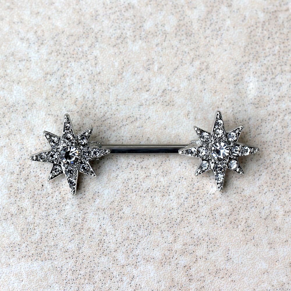 A glittering nipple bar featuring a North Star design with clear cubic zirconia accents, made from durable 316L stainless steel.