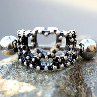 A stylish 316L stainless steel heart crown cartilage cuff earring featuring a black plated crown design with decorative dots.