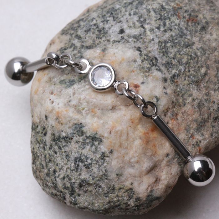 316L Stainless Steel Press Fit CZ Chain Industrial Barbell featuring a clear cubic zirconia centerpiece and flexible chain design.