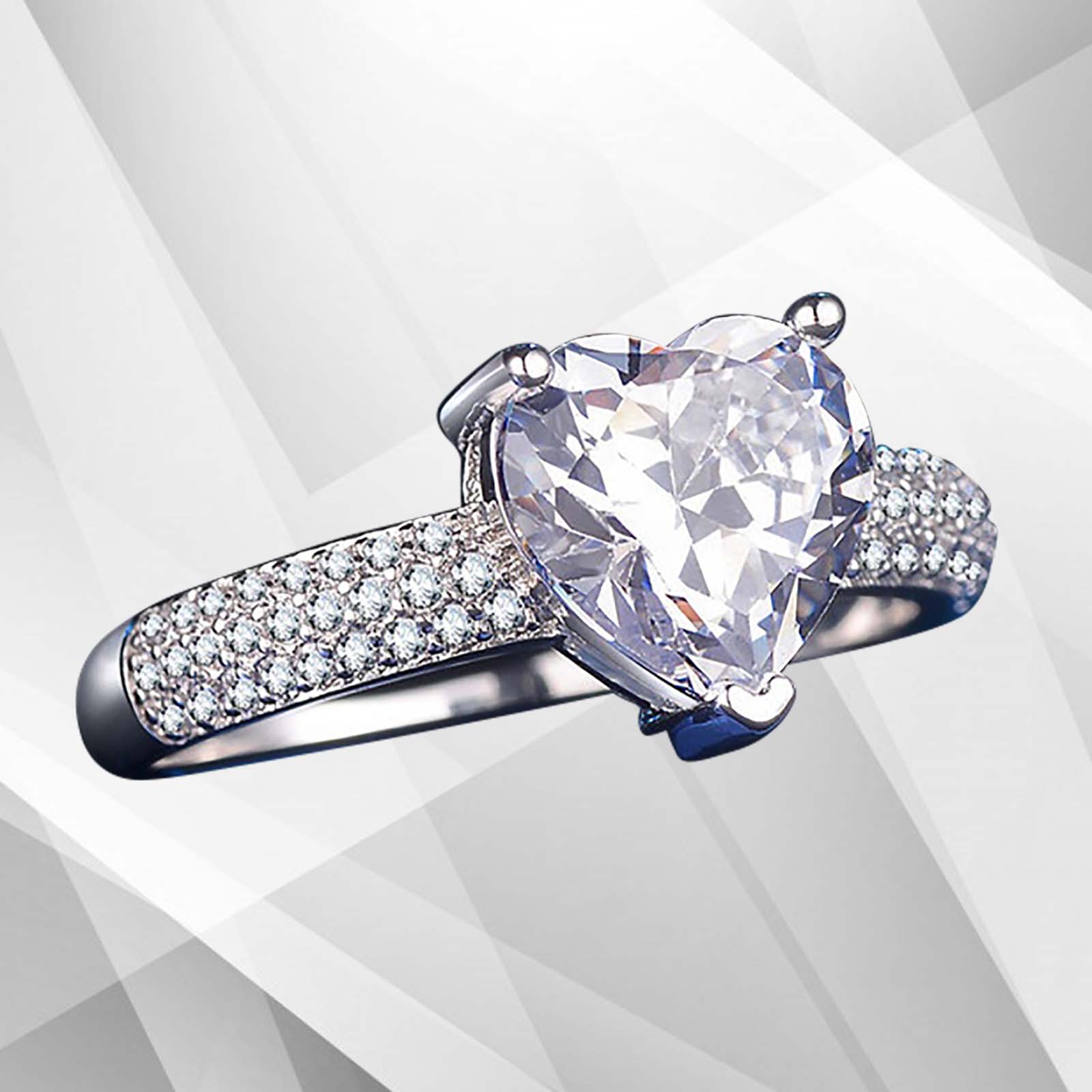 3.2Ct heart-shaped diamond solitaire engagement ring set in 18Ct white gold over brass, showcasing its brilliance and elegant design.