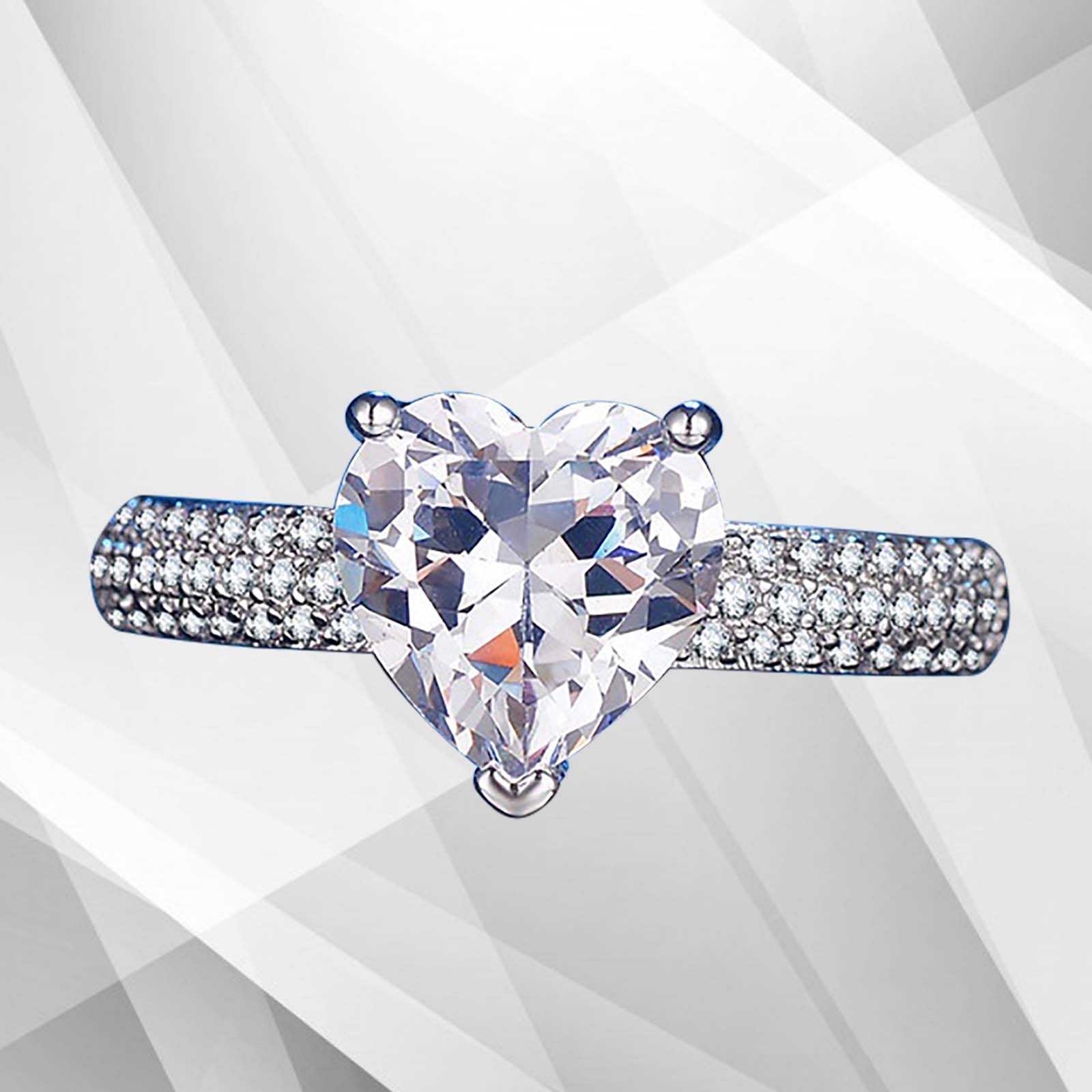 3.2Ct heart-shaped diamond solitaire engagement ring set in 18Ct white gold over brass, showcasing its brilliance and elegant design.