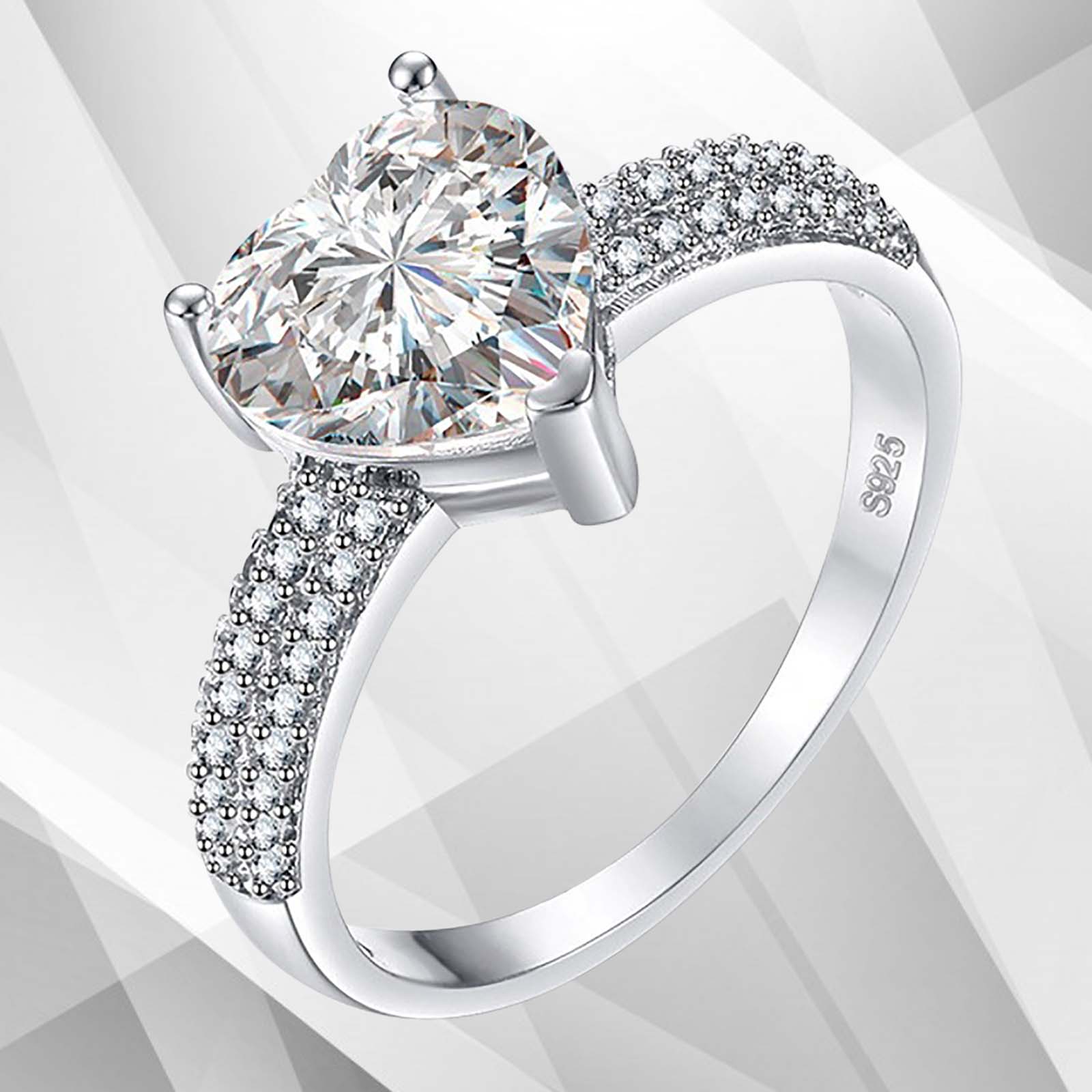 3.2Ct heart-shaped diamond solitaire engagement ring set in 18Ct white gold over brass, showcasing its brilliance and elegant design.
