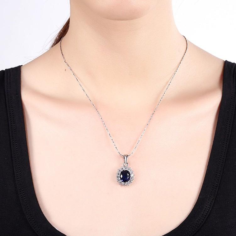 Elegant 3.55 CTTW Sapphire Oval Cut Necklace set in 18K white gold plating, showcasing its stunning blue sapphire and intricate design.