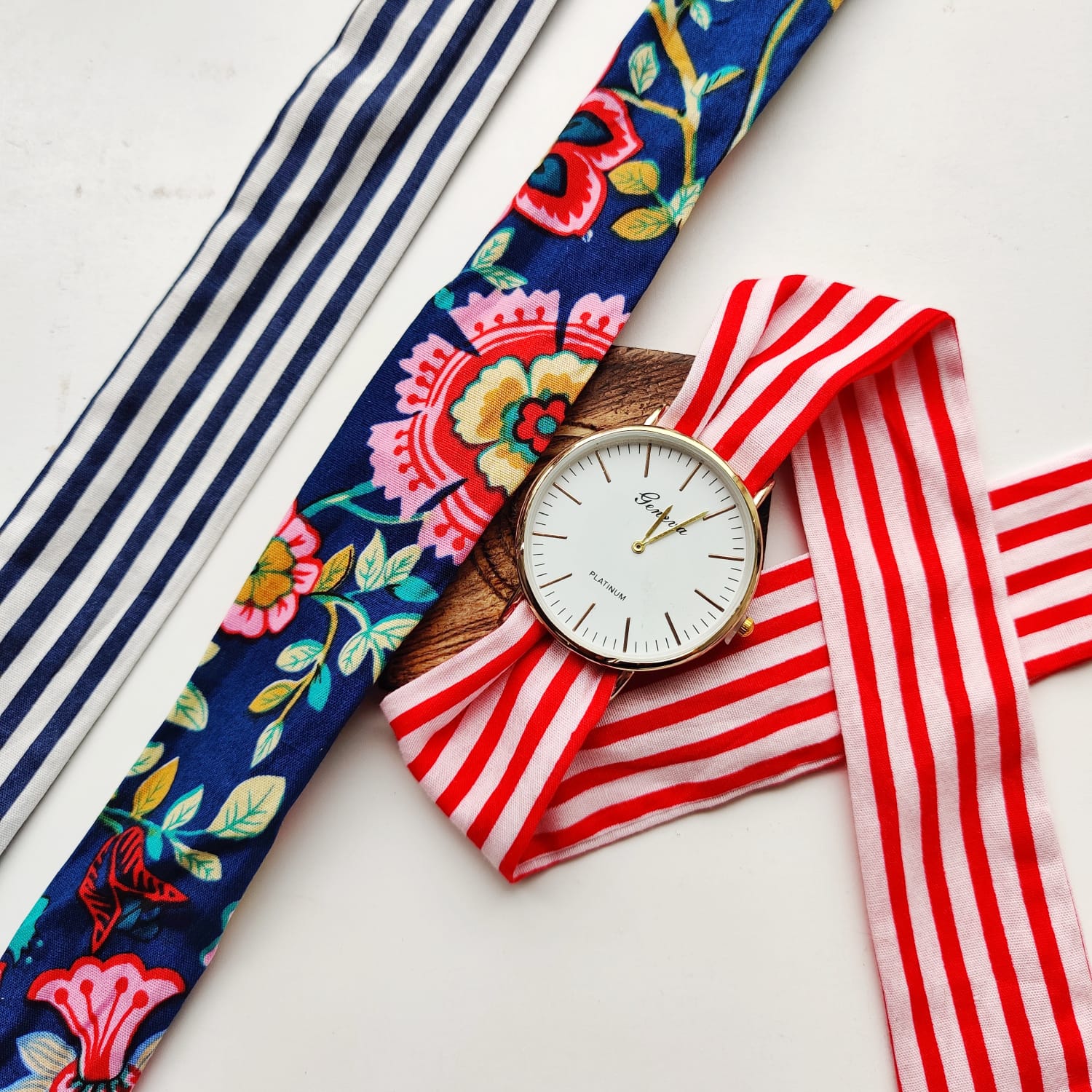 A stylish 3Pcs Stripe Handmade Cotton Strap women wristwatch set featuring three vibrant cotton straps and an elegant analogue dial.