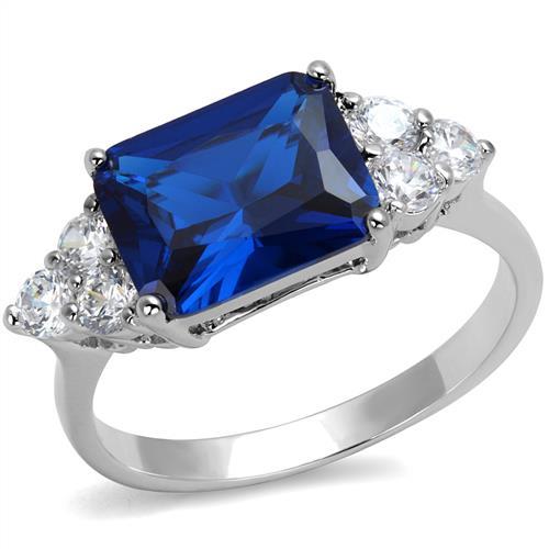 Rhodium brass ring featuring a synthetic London Blue spinel, elegantly designed with a shiny finish.