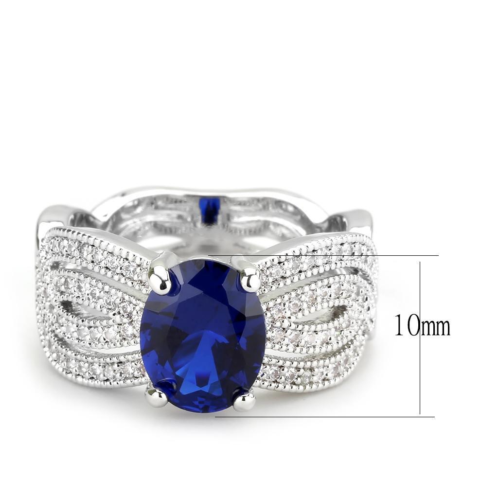 Rhodium brass ring featuring a synthetic London Blue spinel, showcasing its elegant design and vibrant color.