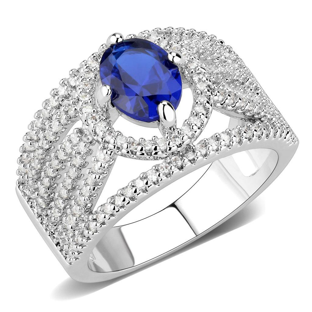 Rhodium brass ring featuring a synthetic London Blue spinel, showcasing its elegant design and vibrant color.