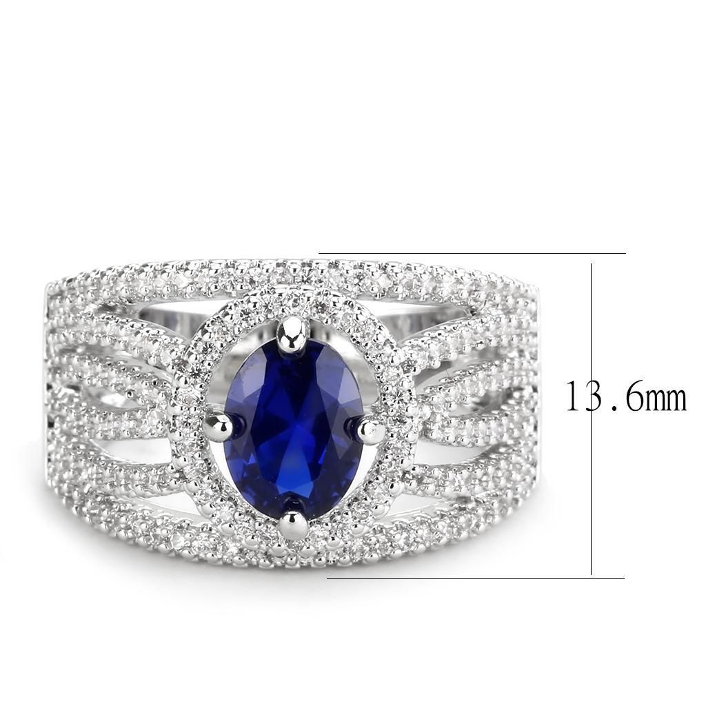 Rhodium brass ring featuring a synthetic London Blue spinel, showcasing its elegant design and vibrant color.