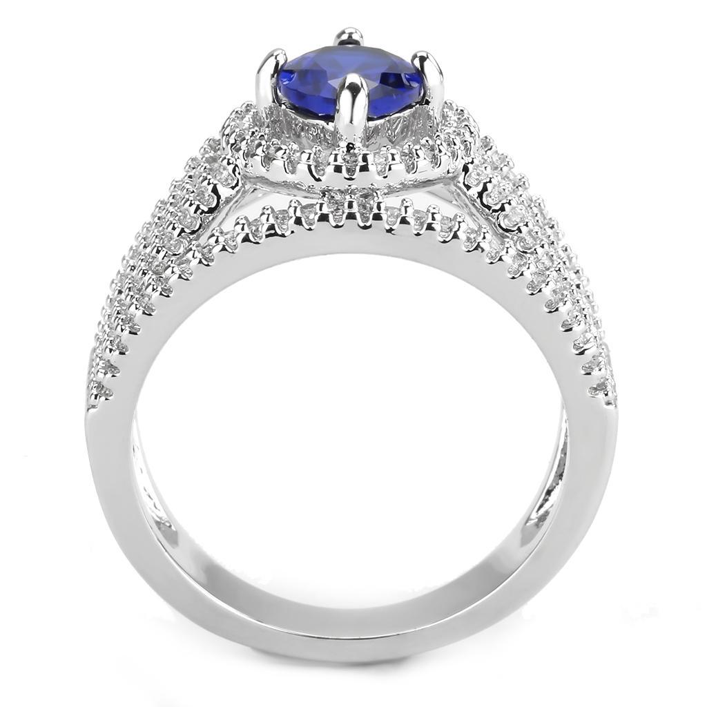 Rhodium brass ring featuring a synthetic London Blue spinel, showcasing its elegant design and vibrant color.