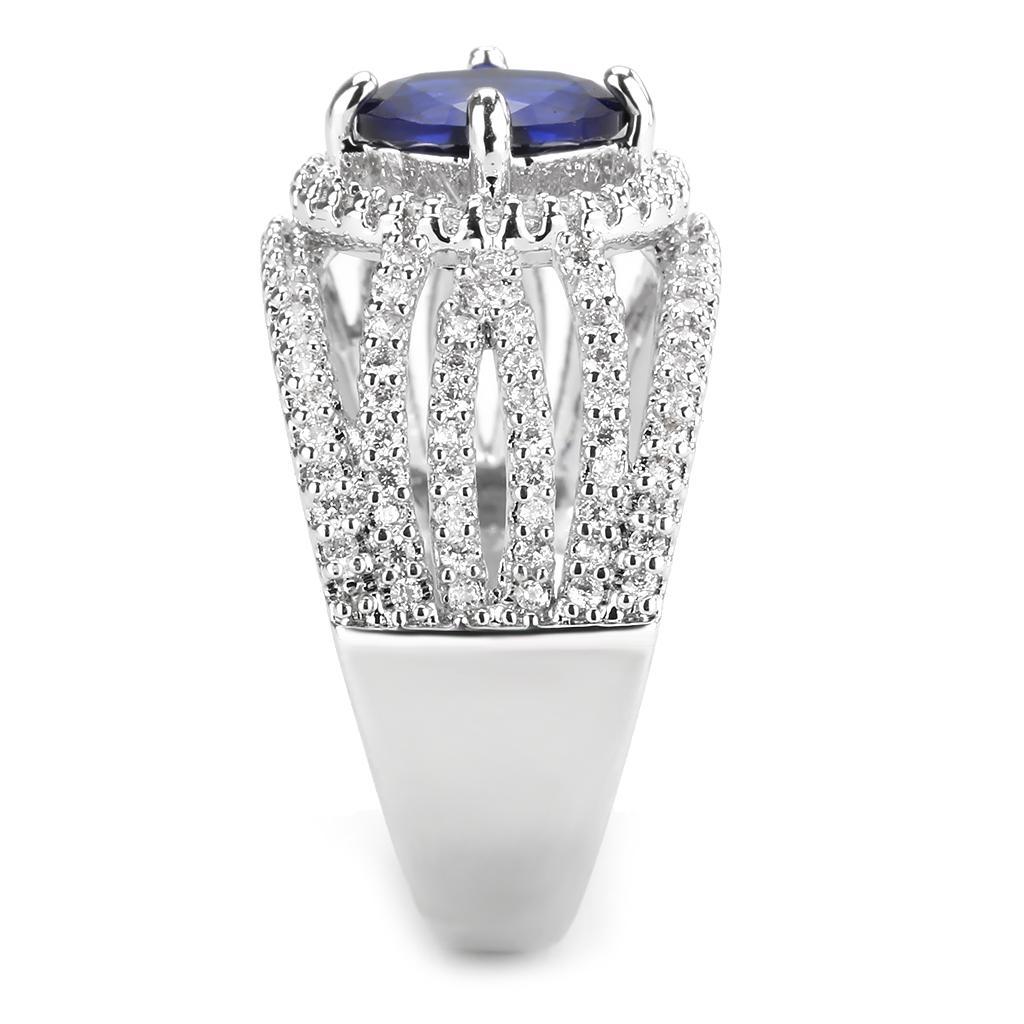 Rhodium brass ring featuring a synthetic London Blue spinel, showcasing its elegant design and vibrant color.